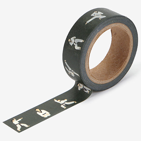 A roll of Daily Like washi tape, featuring people practicing taekwondo on a black background