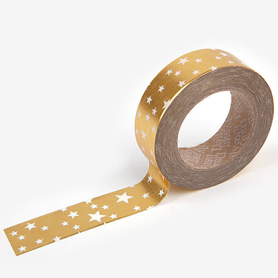 A roll of Daily Like washi tape, featuring white stars on a metallic gold background