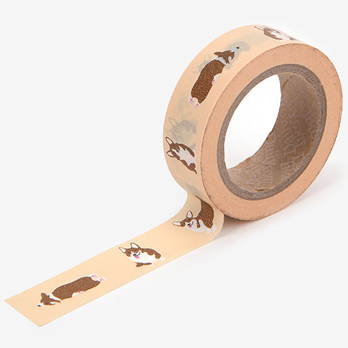 A roll of Daily Like washi tape, featuring Welsh Corgis on a cream background