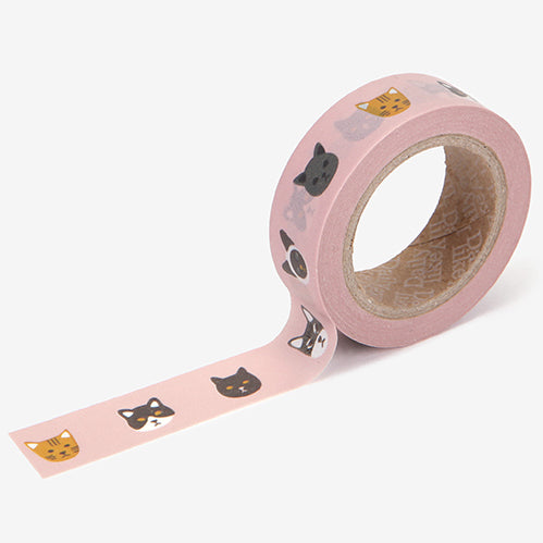 A roll of Daily Like washi tape, featuring kitty faces on a blush pink background