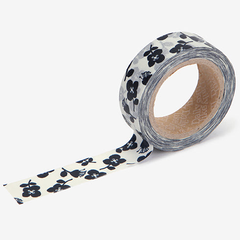 A roll of Daily Like washi tape, featuring black flowers on a white background