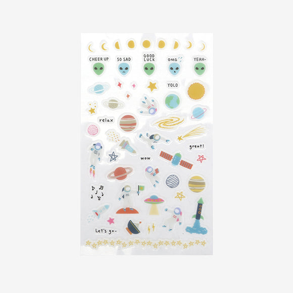 A sheet of Daily Like Outer Space stickers, featuring space ships, astronauts, planets, and aliens
