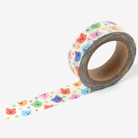 A roll of Daily Like washi tape with rainbow coloured bears and stars on a white background