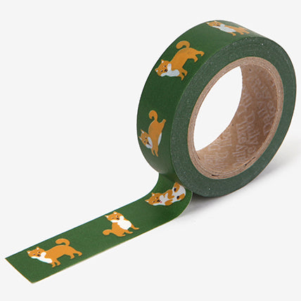A roll of Daily Like washi tape, featuring Shiba Inus on a forest green background