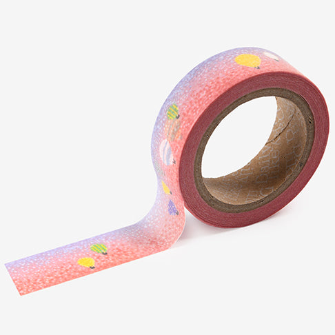 A roll of Daily Like washi tape, featuring hot air balloons on a pink and purple background