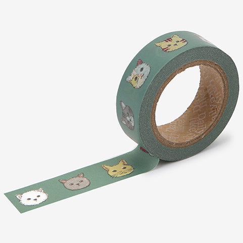 A roll of Daily Like washi tape, featuring pixel art cat faces on a green background