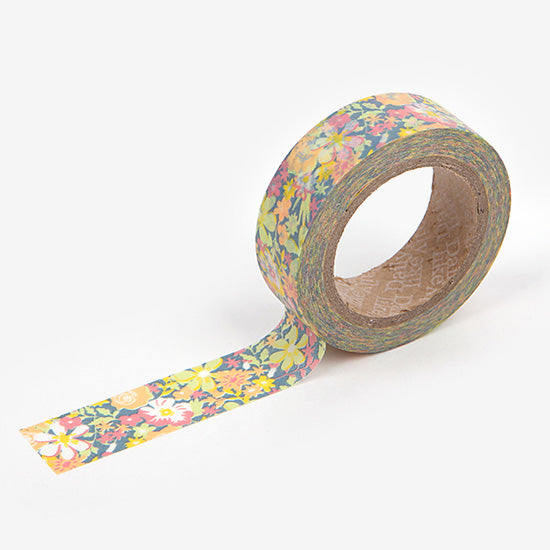 A roll of Daily Like washi tape, featuring neon coloured florals and greenery on a dark green background