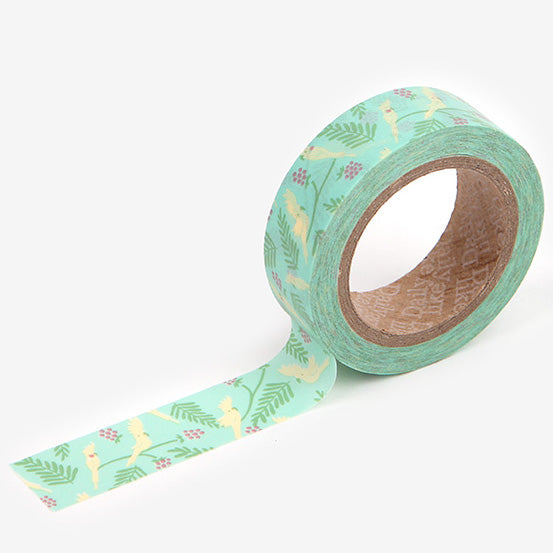 A roll of Daily Like washi tape, featuring Australian cockatiels on a bright mint background