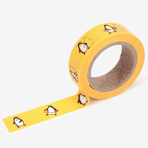A roll of Daily Like washi tape, featuring penguins on a sunny yellow background