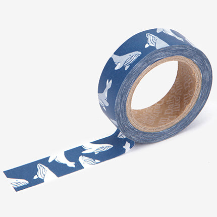A roll of Daily Like washi tape, featuring whales on a sea blue background