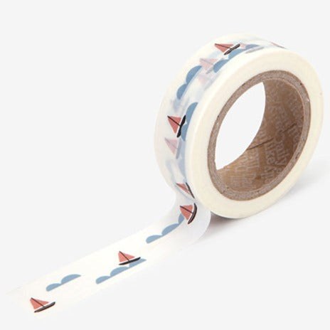 A roll of Daily Like washi tape, featuring sailboats and waves on a white background